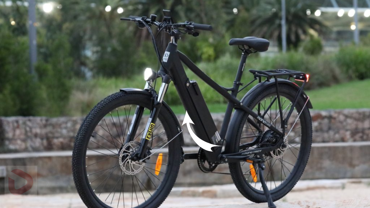a black bicycle with an arrow pointing to the front